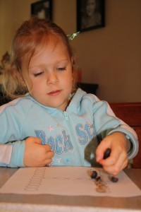 Practicing alphabet letter recognition with acorns