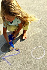 Listen and Spray Counting Game-fun outdoor math activity for preschoolers using sidewalk chalk
