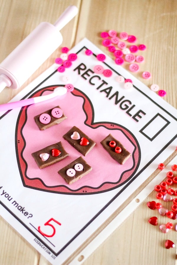 Valentine Play Dough Shape Mats - learn about shapes and practice fine motor skills with this free printable