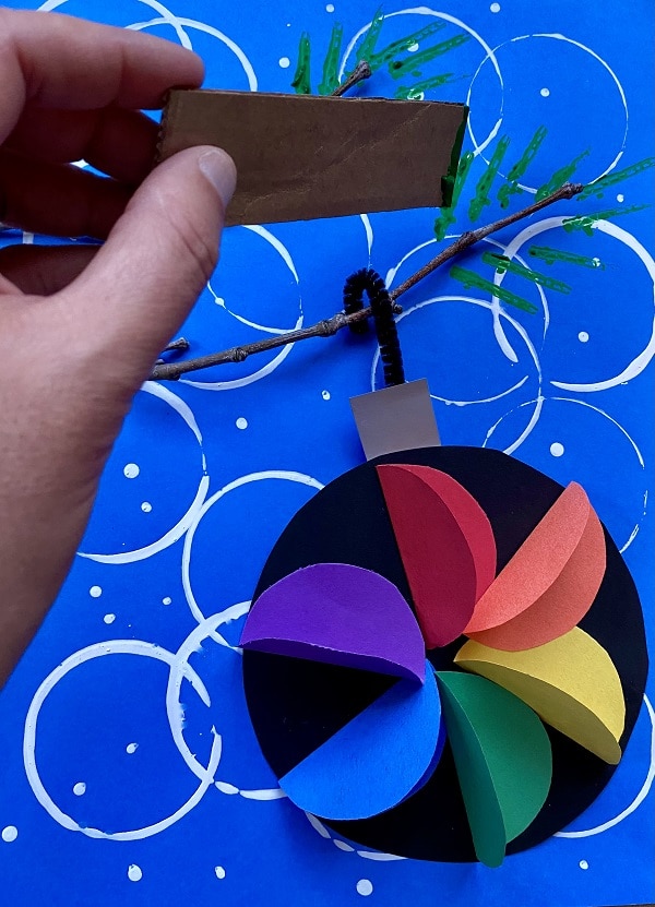 Add detail to Christmas Ornament Art Project for Kids